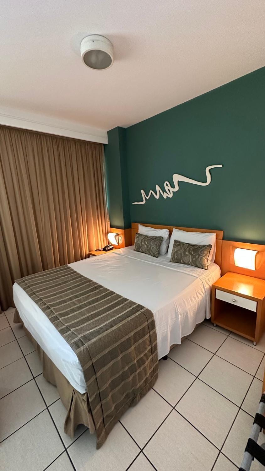Praia do Canto Apart Hotel quarto sala e varanda Apartment in Vitoria