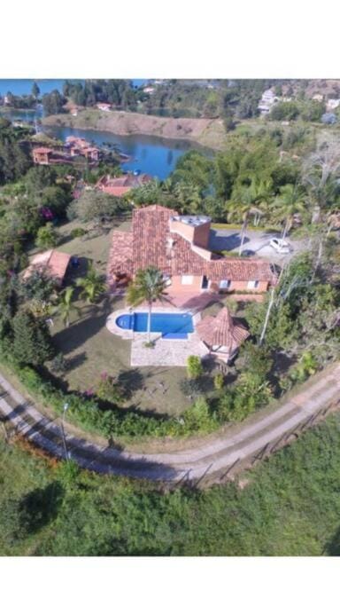 Property building, Day, Natural landscape, Bird's eye view, Lake view, Pool view, Street view, Swimming pool
