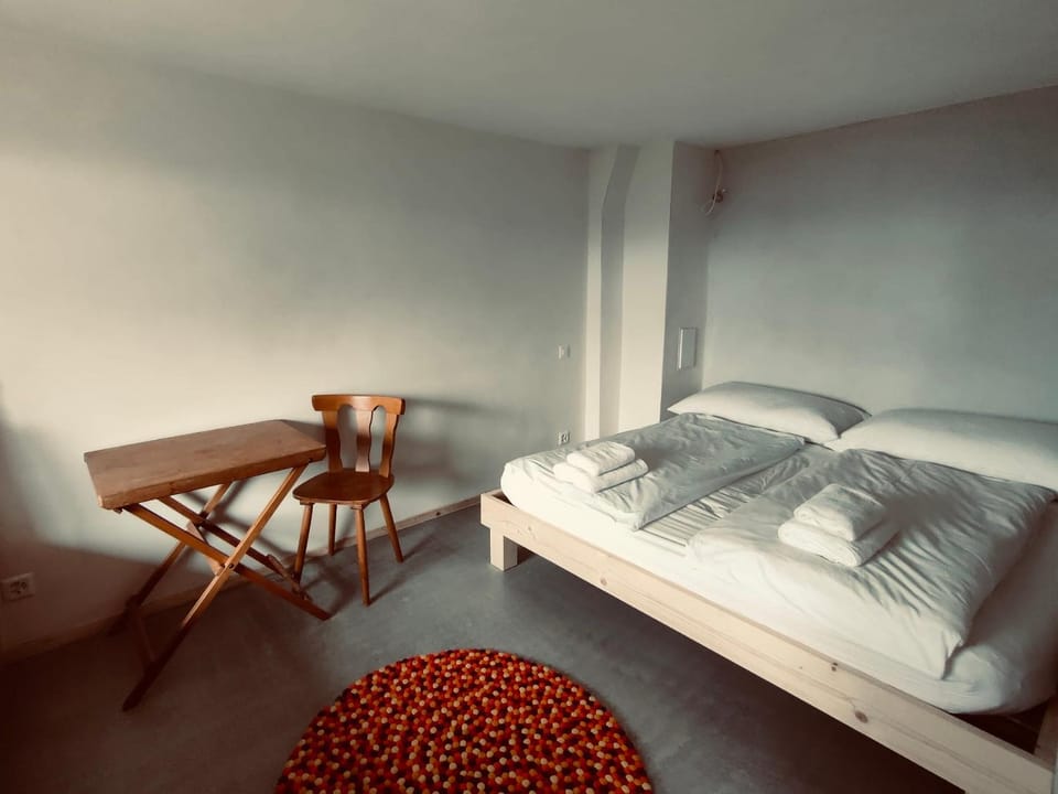 Bed, Seating area, Bedroom