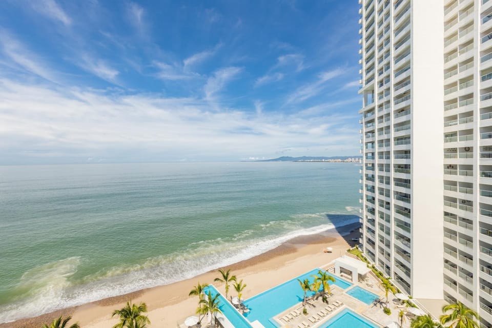 Property building, Nearby landmark, Day, Natural landscape, View (from property/room), Balcony/Terrace, Beach, City view, Pool view, Sea view, Swimming pool, sunbed