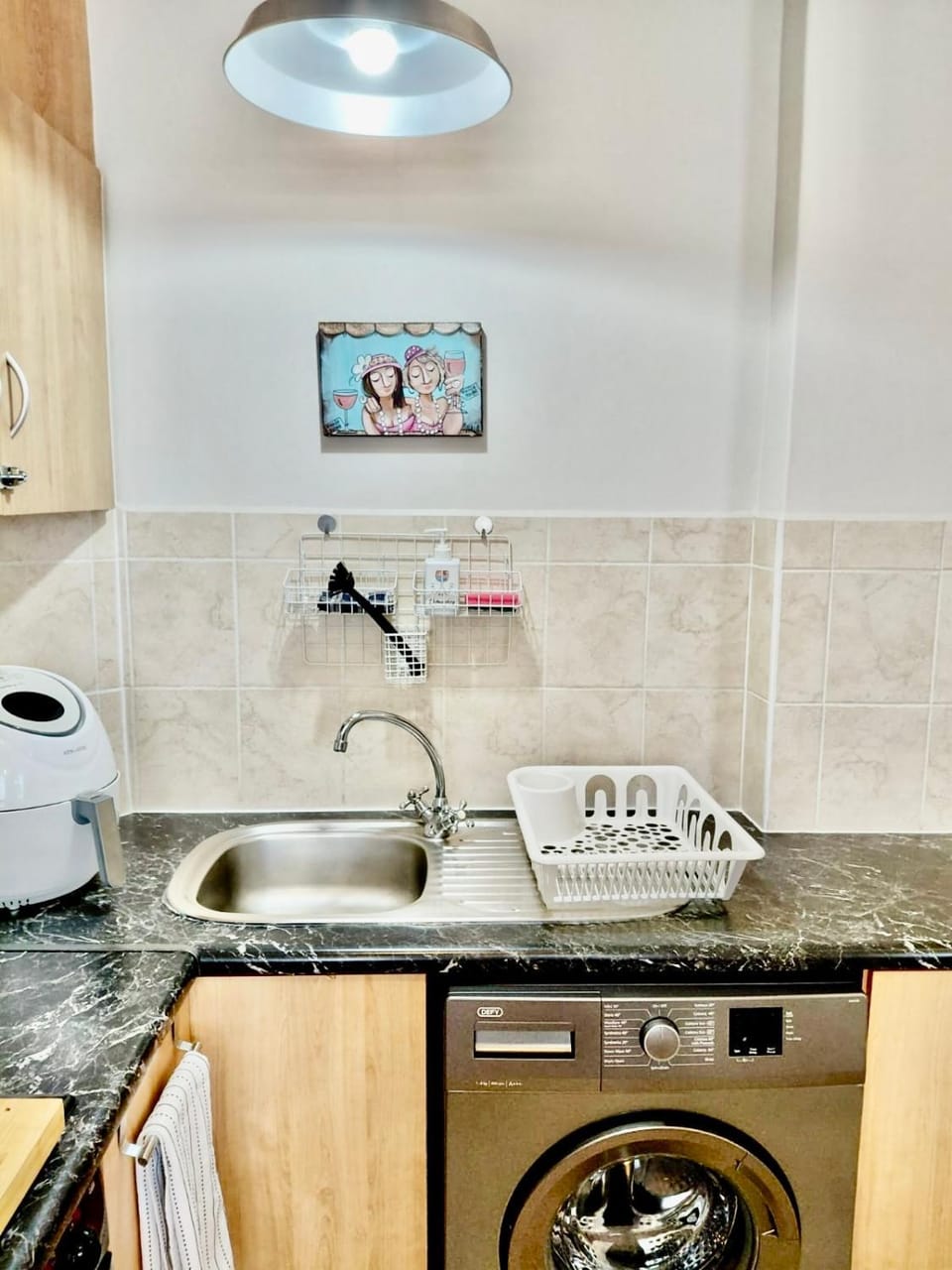 Kitchen or kitchenette, stove, washing machine