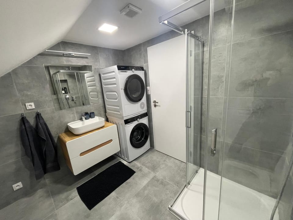 Shower, towels, washing machine, dryer