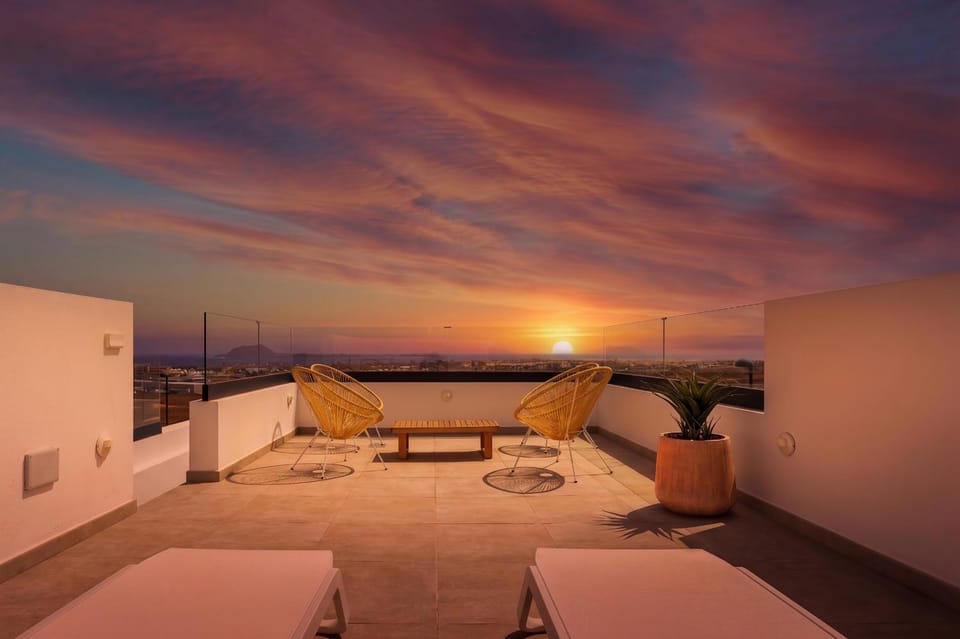 Natural landscape, View (from property/room), Balcony/Terrace, Seating area, Sunset, sunbed