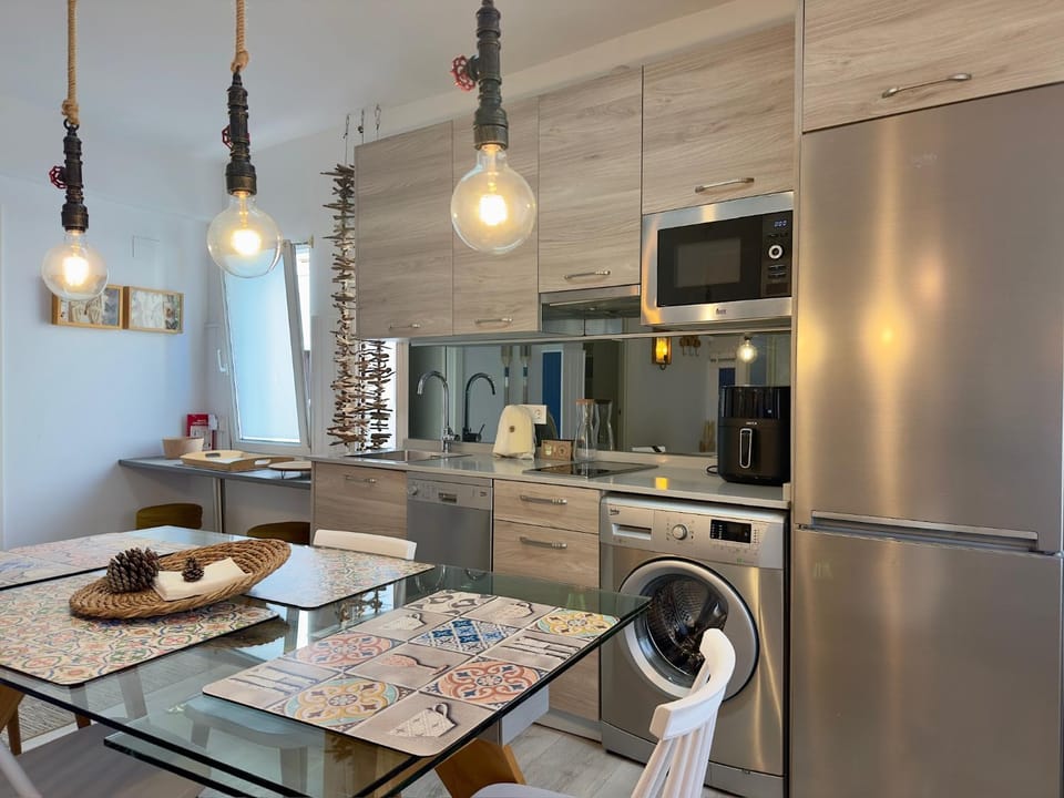 Dining area, dishwasher, microwave, stove, washing machine