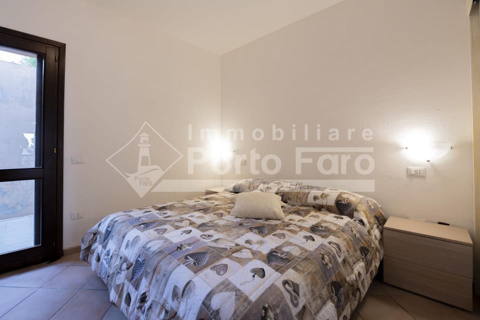 L324 - Bilocale con giardino e vista mare panoramica a Porto Mannu Villa in Sardinia