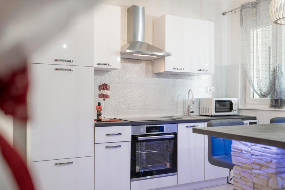 Kitchen or kitchenette, dishwasher, oven, stove, toaster