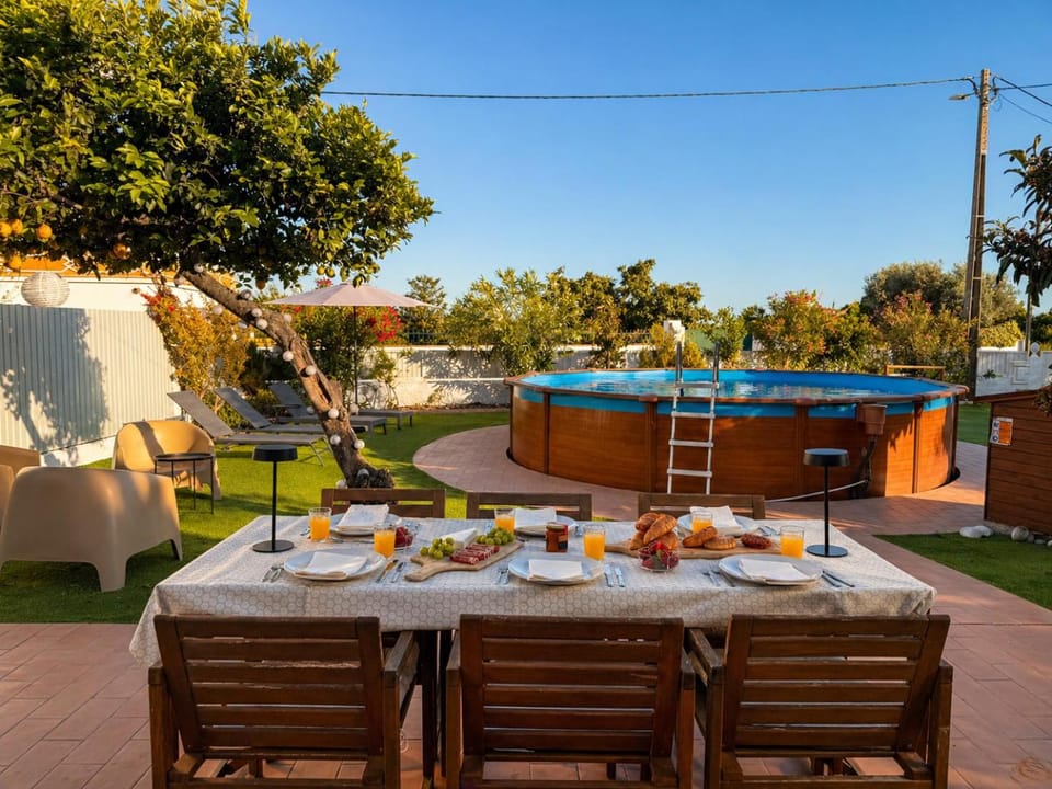 Patio, Day, Natural landscape, Garden, Dining area, Garden view, Pool view, Swimming pool, sunbed