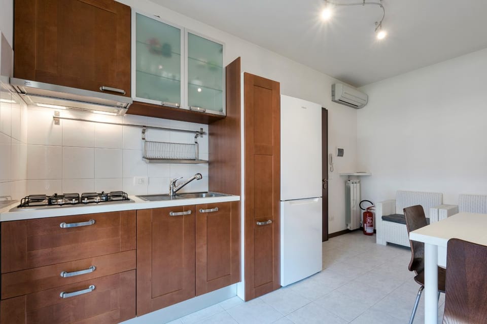 Kitchen or kitchenette, stove, air conditioner