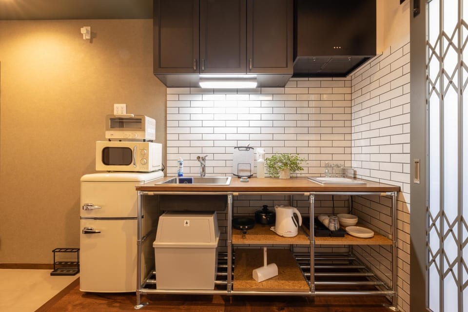 Photo of the whole room, minibar, stove, toaster, kitchen
