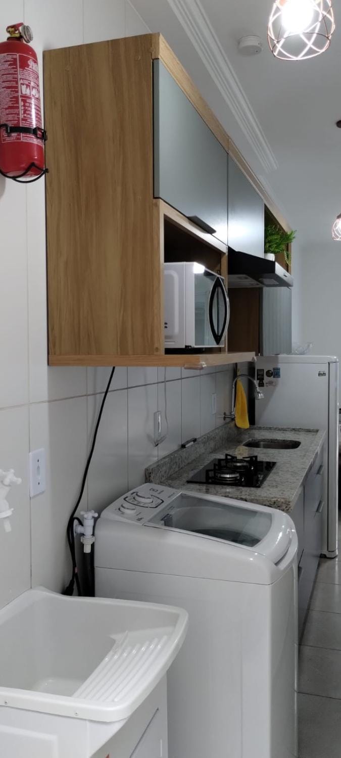 Kitchen or kitchenette, stove, washing machine