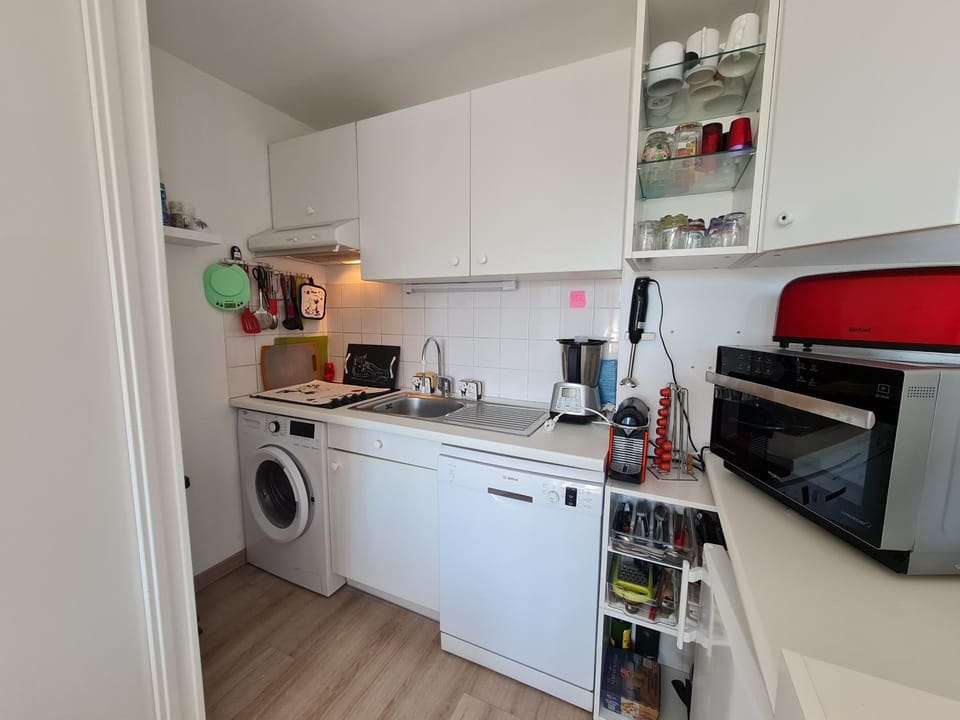 Kitchen or kitchenette, dishwasher, stove, toaster, washing machine