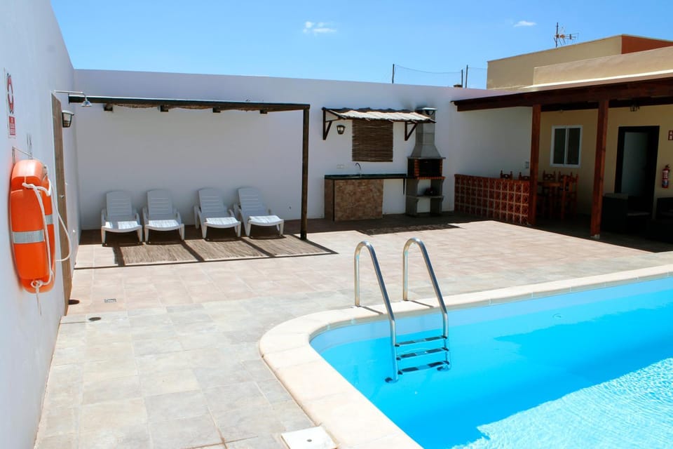 Property building, Living room, Swimming pool
