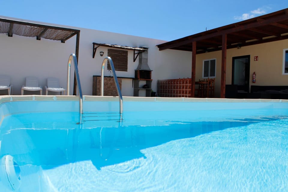 Property building, Living room, Swimming pool