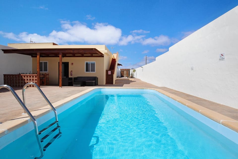 Property building, Living room, Swimming pool
