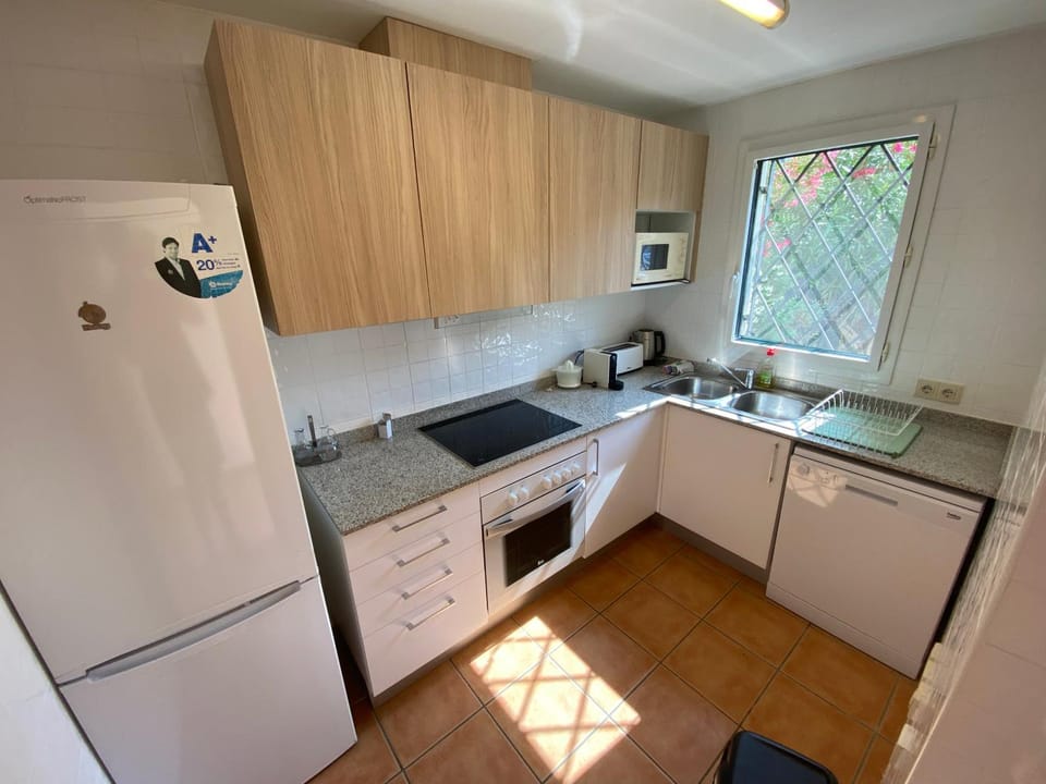 Kitchen or kitchenette, dishwasher, oven, stove