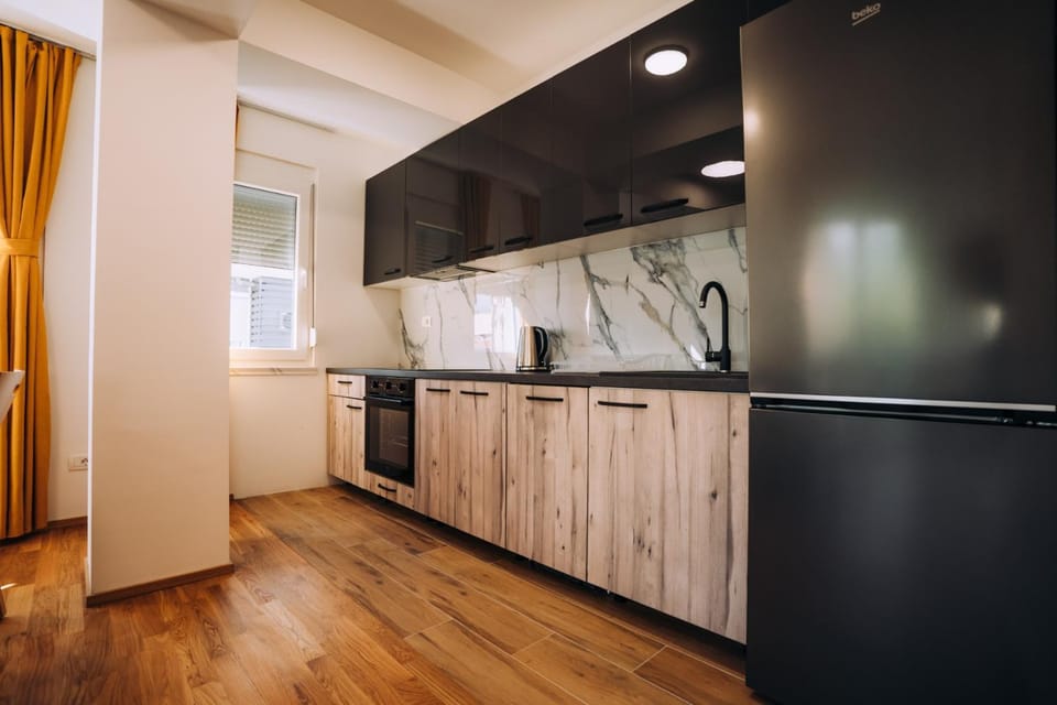 Kitchen or kitchenette, dishwasher, oven, stove