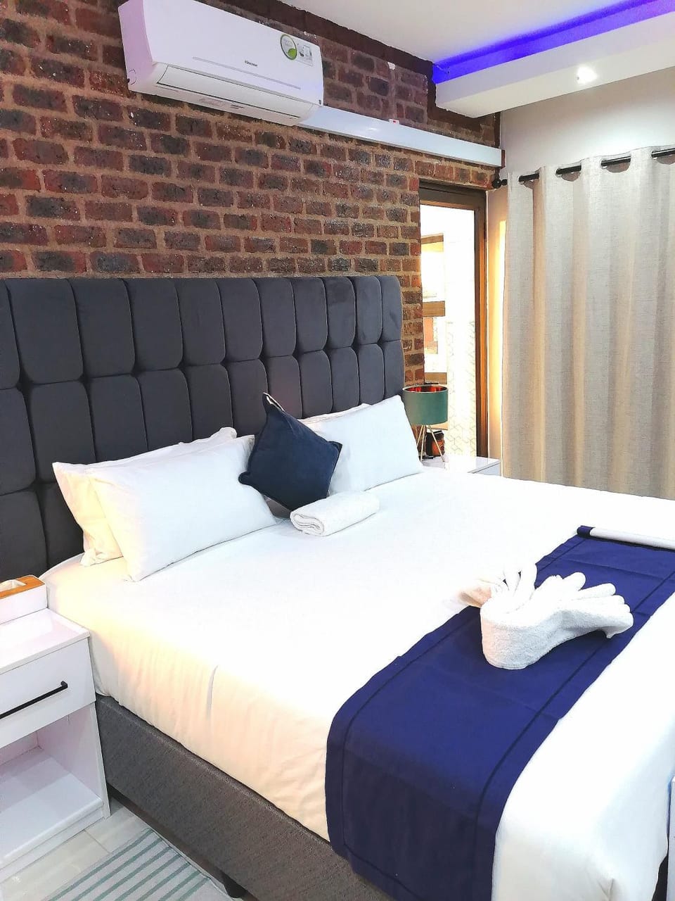 Bed, Photo of the whole room, Bedroom, towels, air conditioner