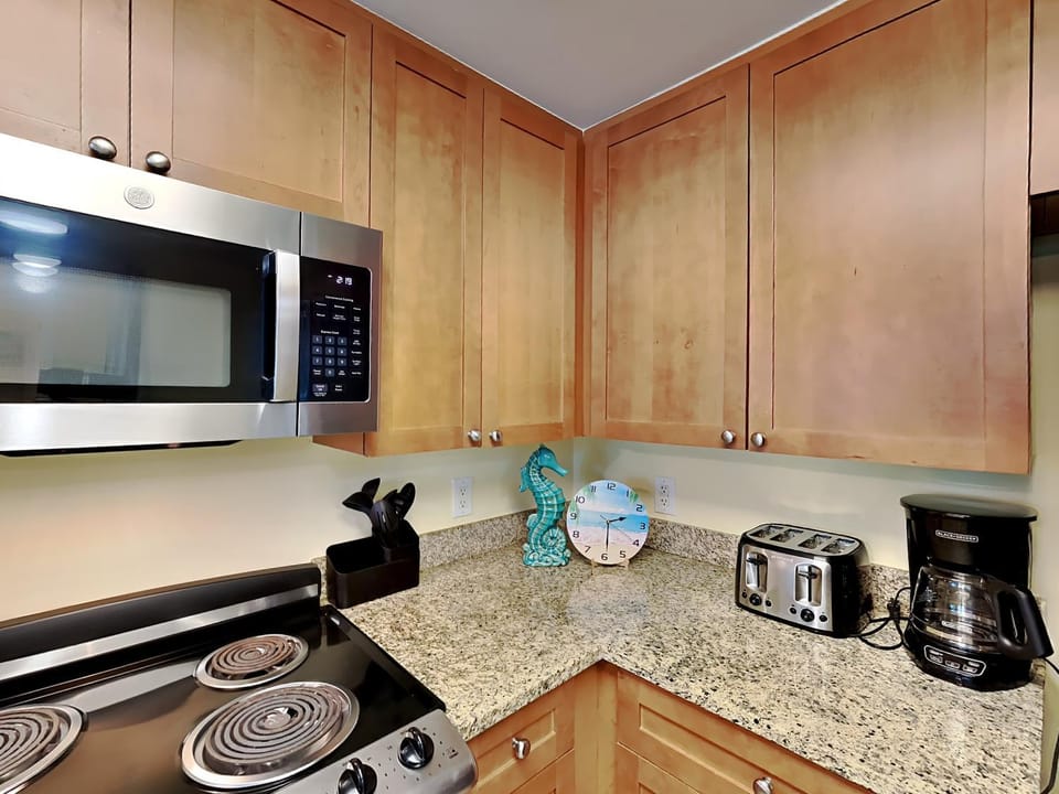 Kitchen or kitchenette, furniture, microwave, stove, toaster, kitchen