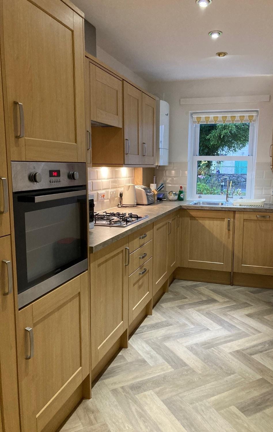 Kitchen or kitchenette, dishwasher, stove, toaster, washing machine