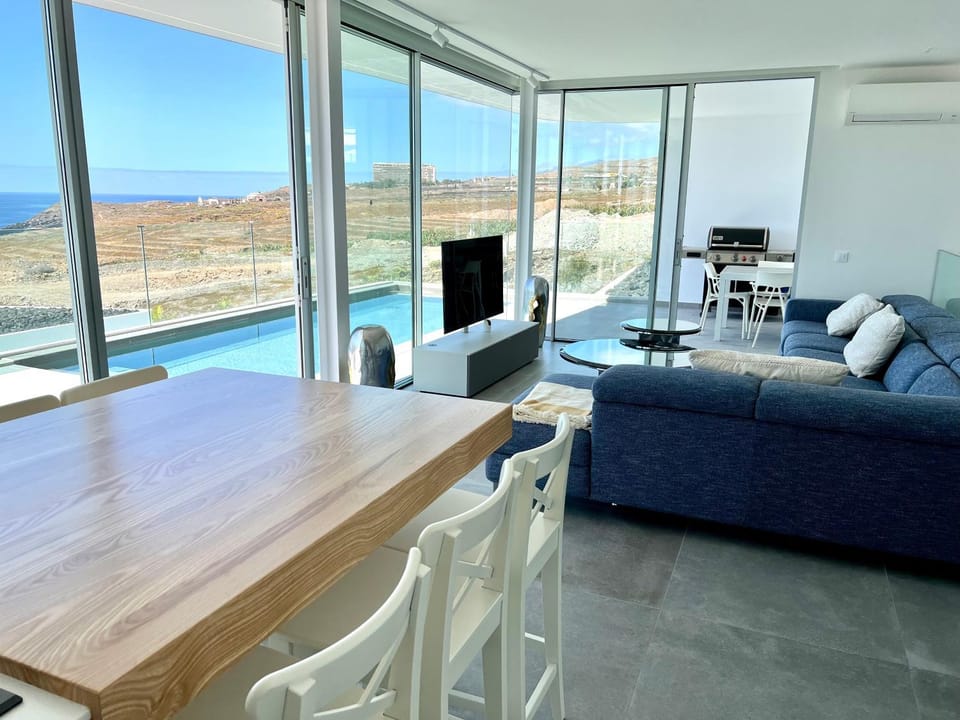 Living room, Seating area, Pool view, Sea view