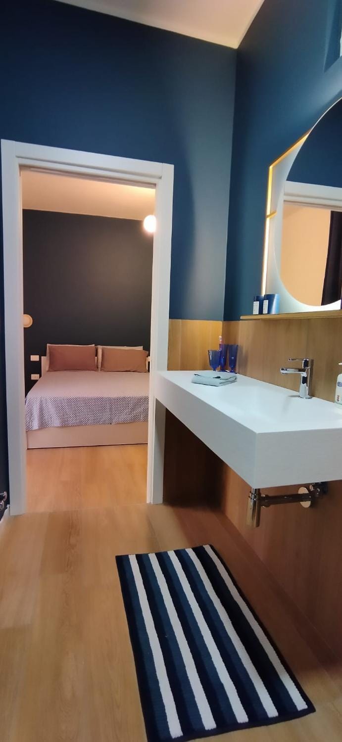 Bed, Bathroom, Photo of the whole room, Bedroom, furniture, hair dryier, towels, air conditioner