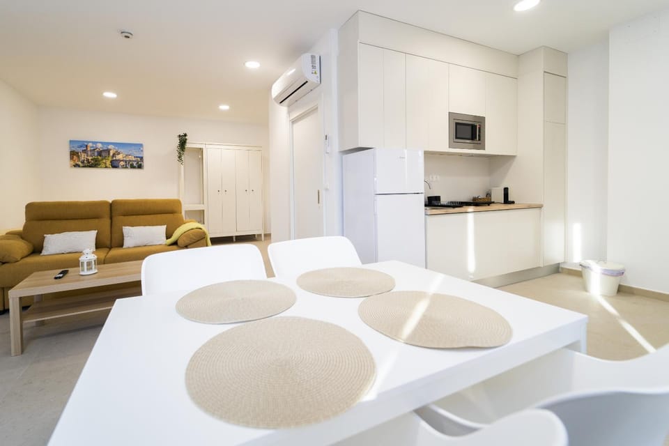 TV and multimedia, Kitchen or kitchenette, Living room, Photo of the whole room, Seating area, Dining area, air conditioner