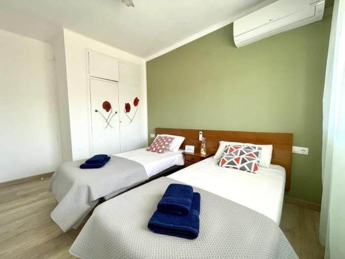 Bed, Photo of the whole room, Bedroom, towels, air conditioner
