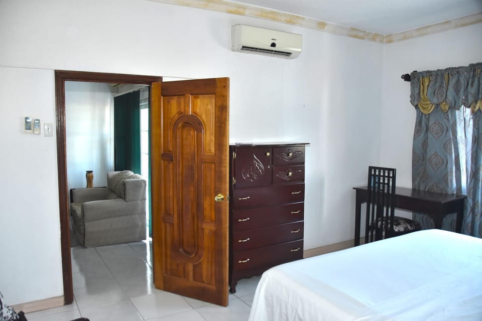 Bed, Living room, Seating area, Bedroom, air conditioner