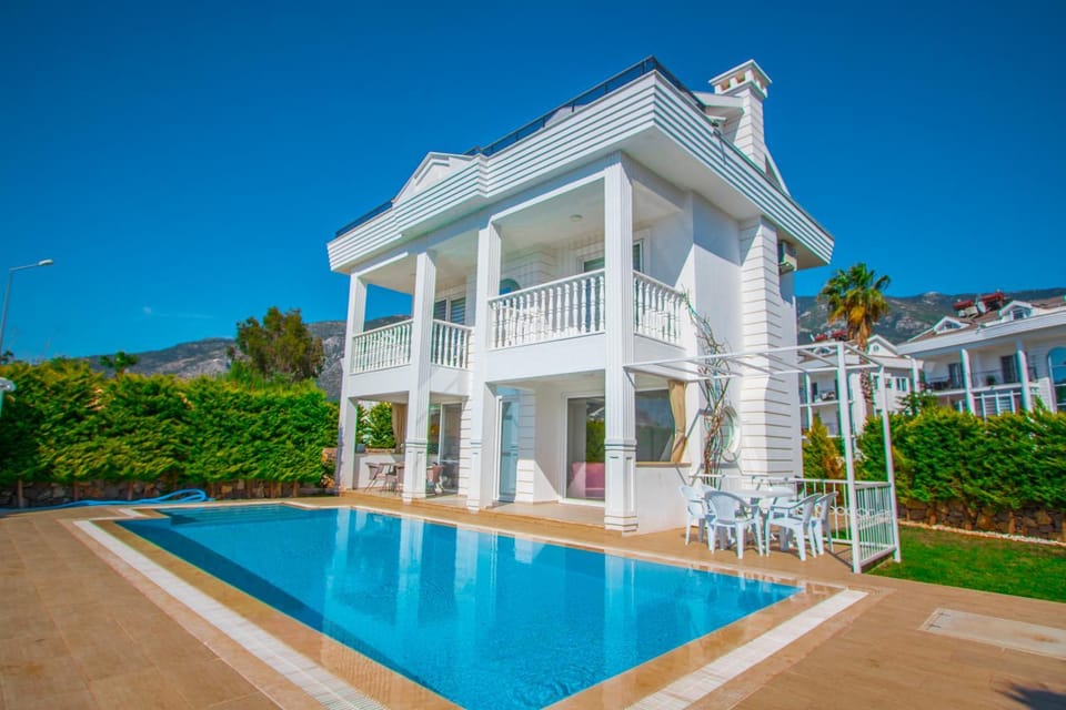 Property building, Patio, Seating area, Swimming pool
