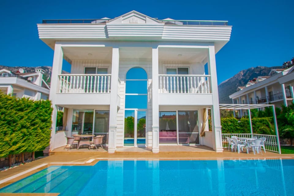 Property building, Patio, Seating area, Swimming pool