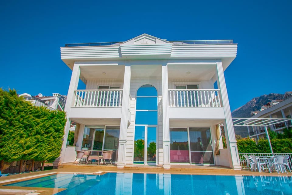 Property building, Patio, Seating area, Swimming pool