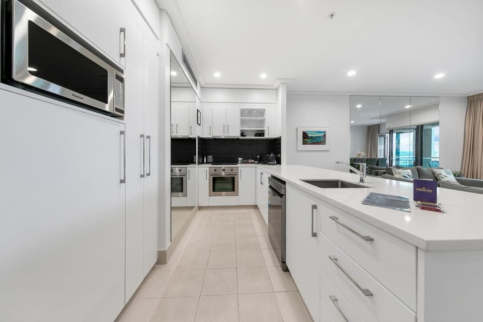 Kitchen or kitchenette, dishwasher, oven, stove