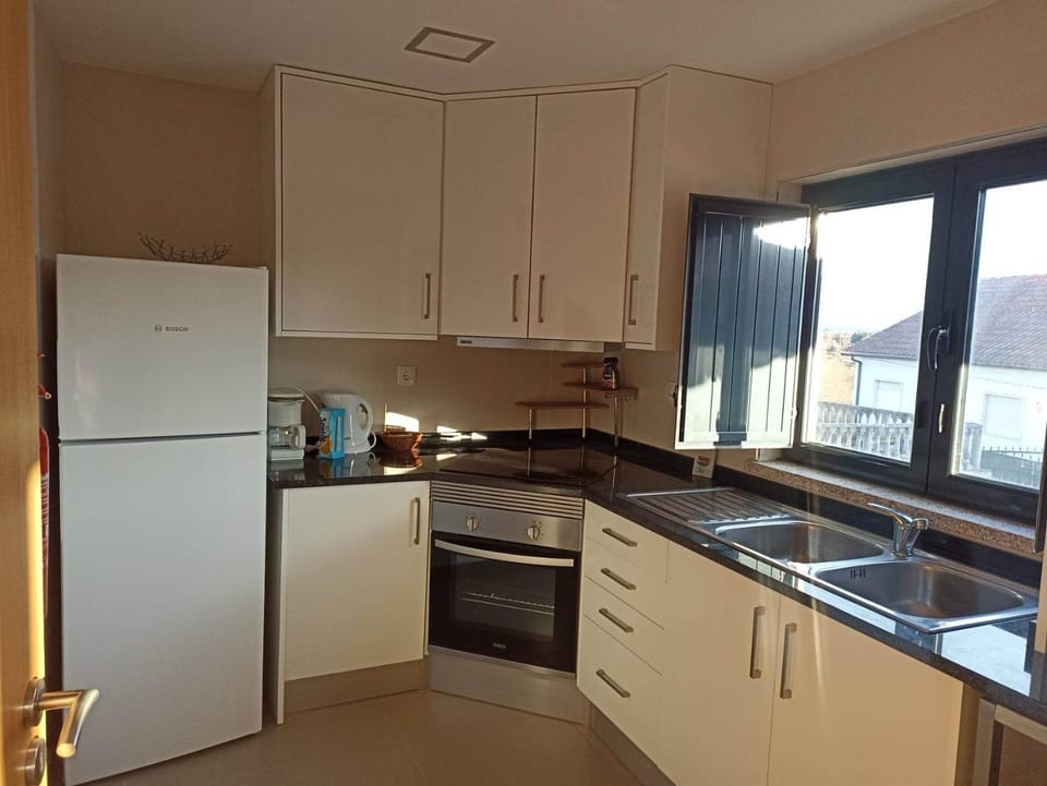 Kitchen or kitchenette, dishwasher, oven, stove