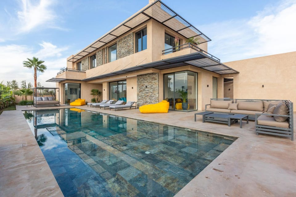 Property building, Patio, Day, Living room, Seating area, Pool view, Swimming pool, sunbed