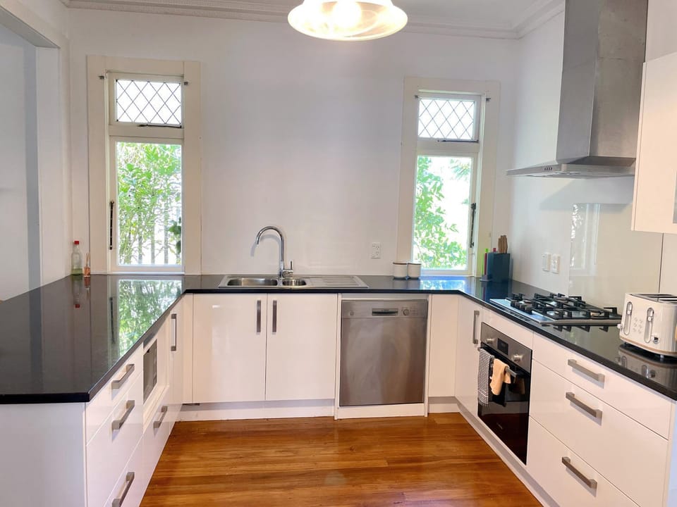 Kitchen or kitchenette, dishwasher, oven, stove
