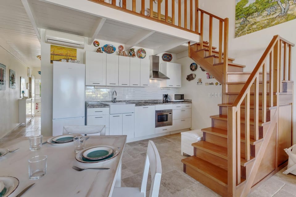 Kitchen or kitchenette, dishwasher, oven, stove