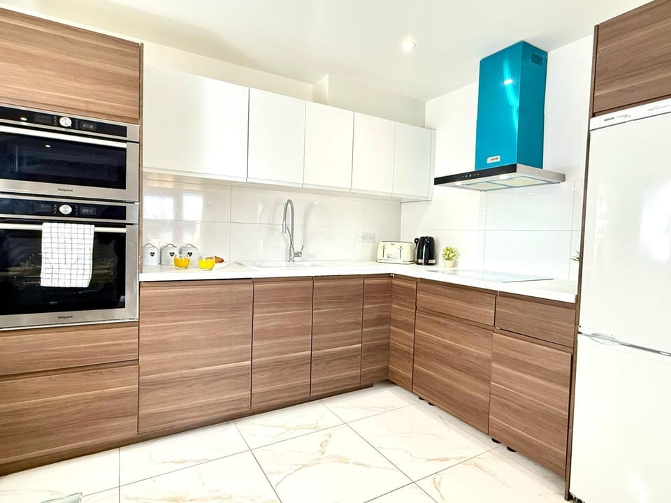 Kitchen or kitchenette, dishwasher, oven, stove