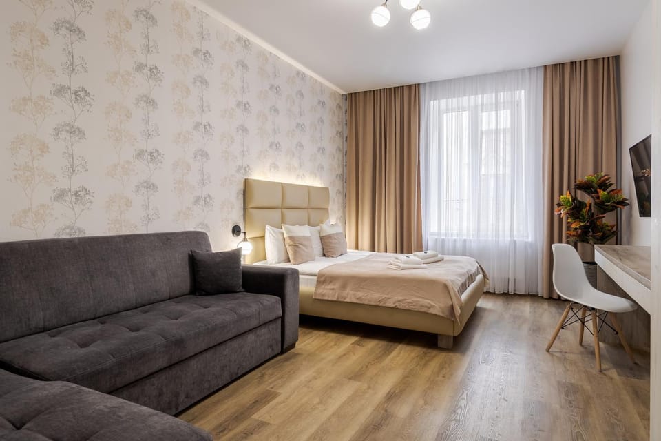 Bed, TV and multimedia, Living room, Seating area, Bedroom