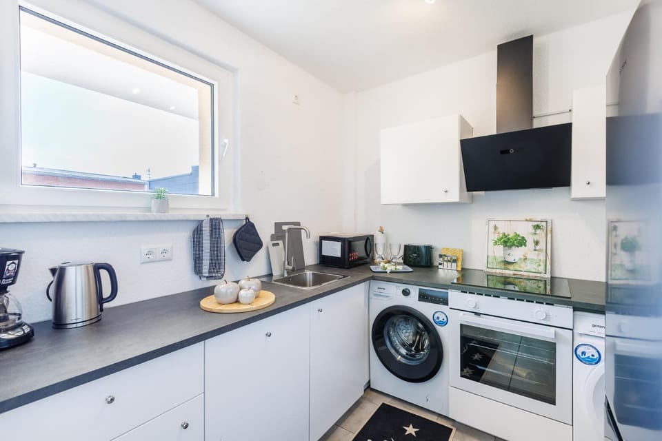 Kitchen or kitchenette, oven, stove, toaster, washing machine