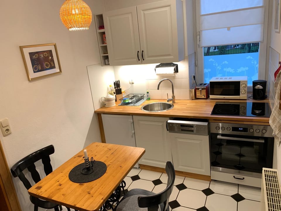 Kitchen or kitchenette, dishwasher, oven, stove, toaster