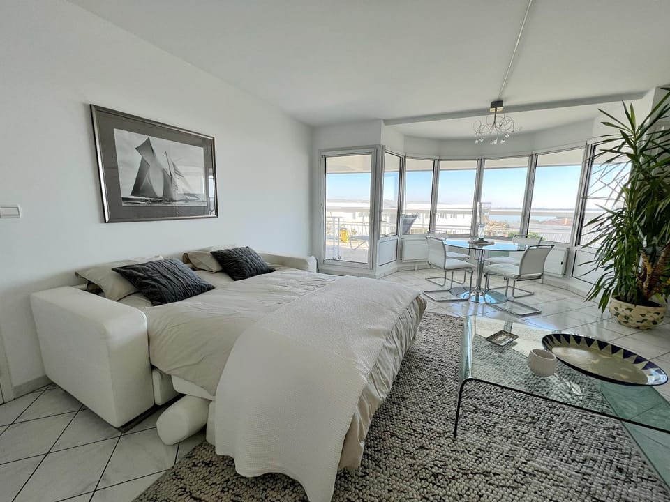 Bed, Living room, Seating area, Sea view