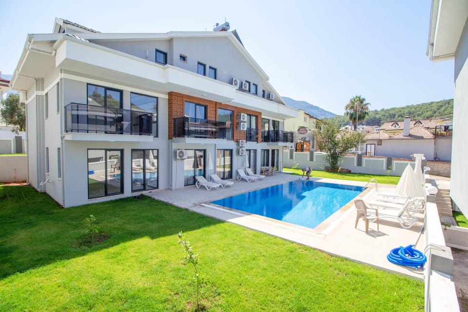 Property building, Patio, Swimming pool, sunbed