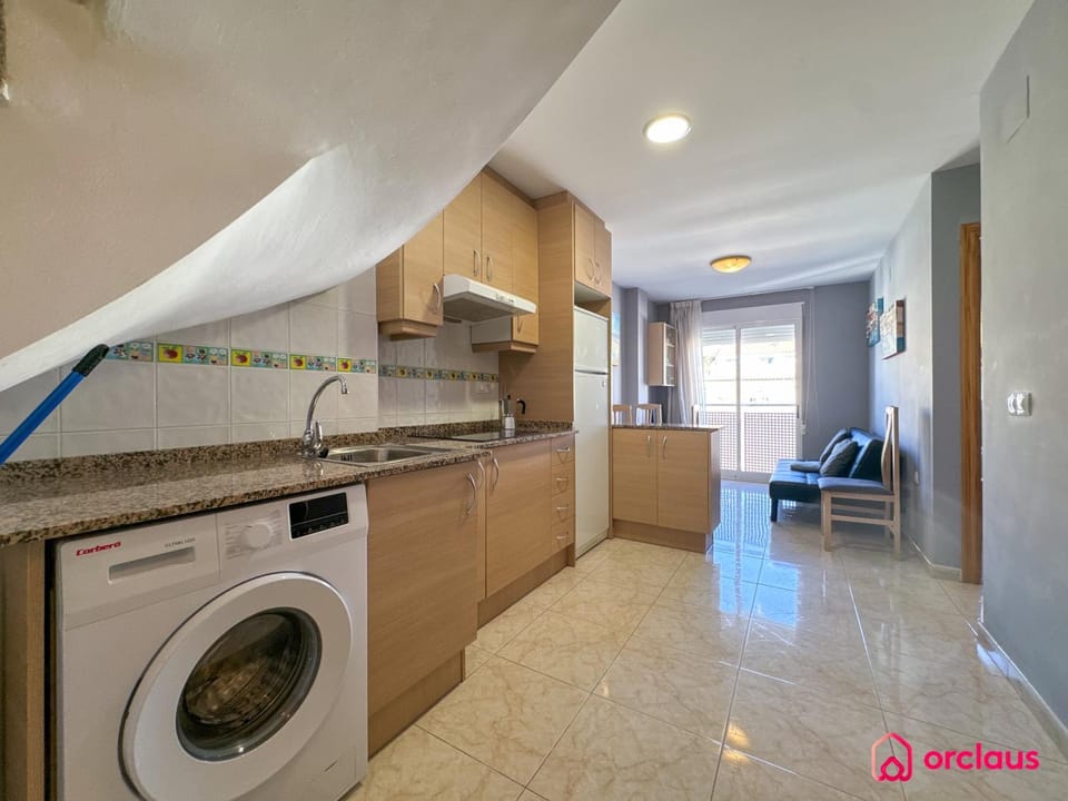 Kitchen or kitchenette, stove, washing machine