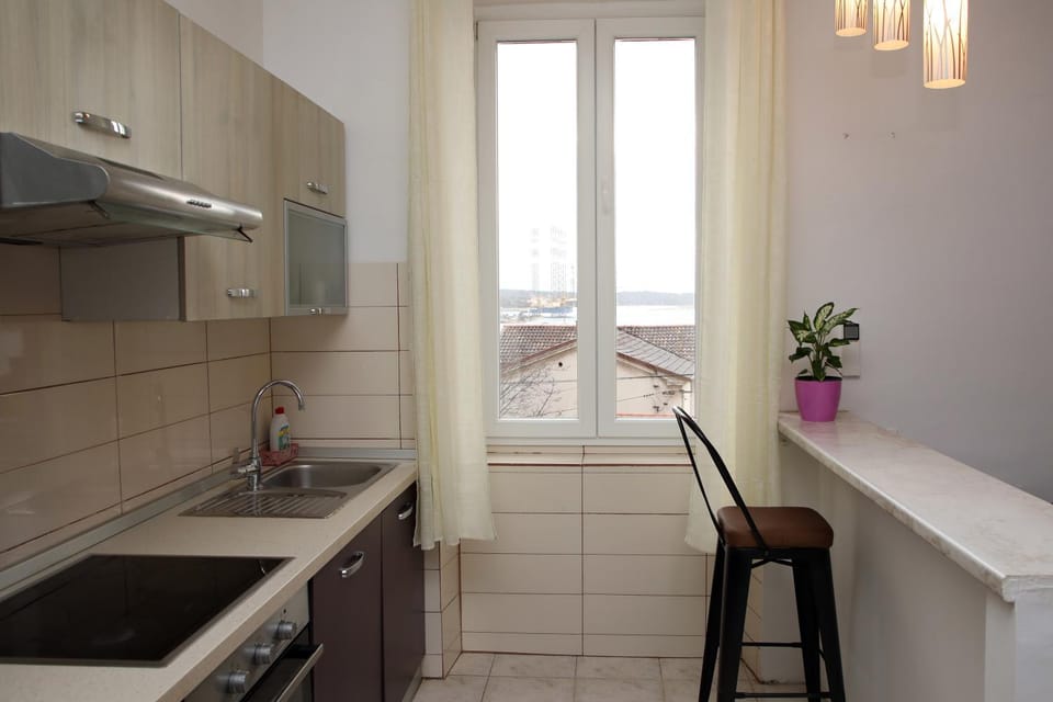 Kitchen or kitchenette, stove