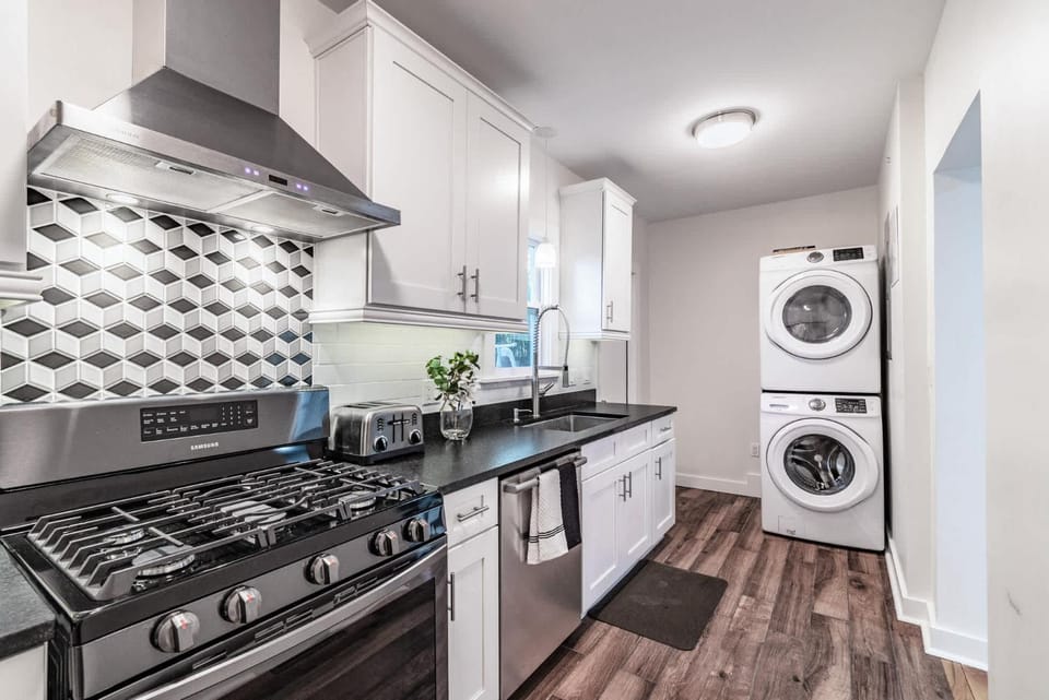 Kitchen or kitchenette, dishwasher, oven, stove, toaster, washing machine, dryer