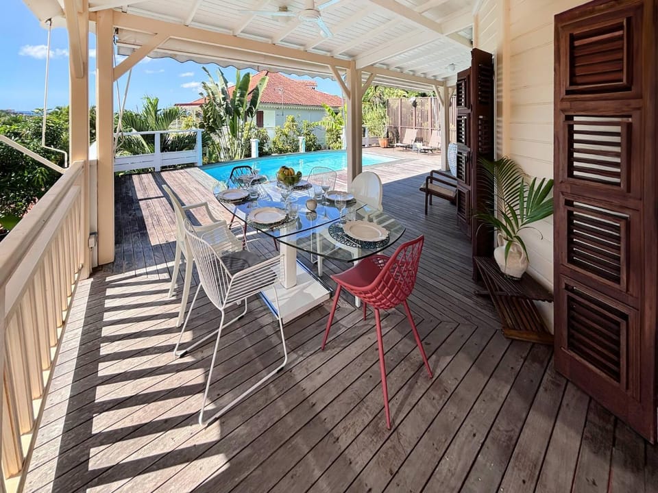 Patio, Off site, Day, View (from property/room), Balcony/Terrace, Living room, Dining area, Pool view, Swimming pool, sunbed