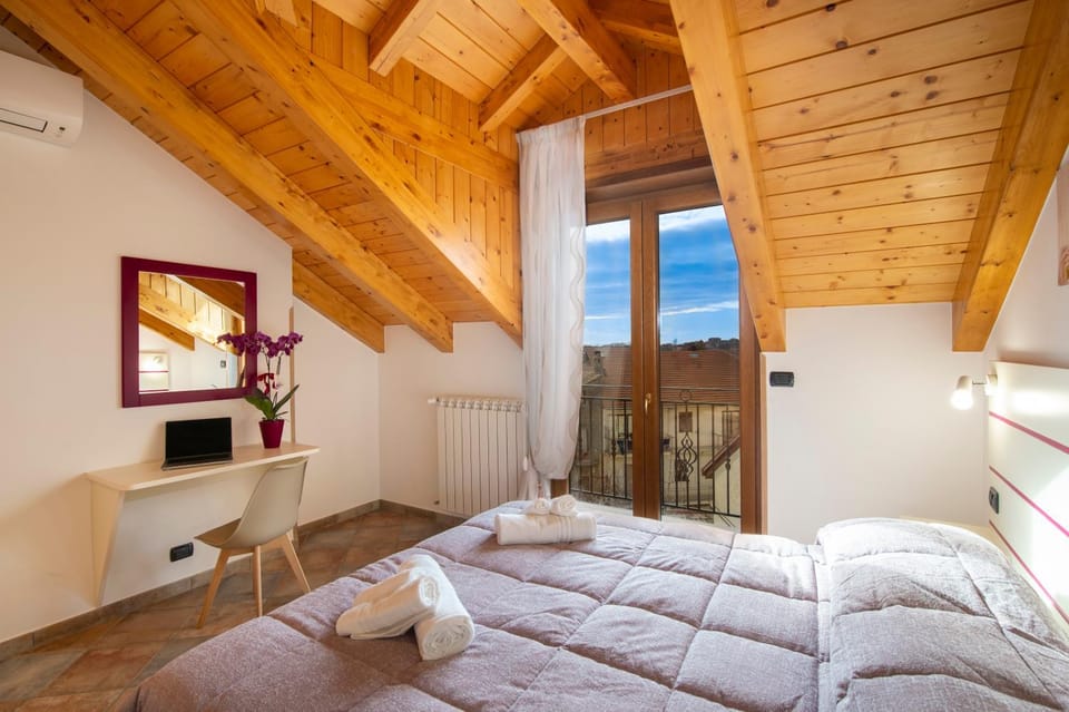 Bed, Seating area, Bedroom, towels, air conditioner, air conditioner