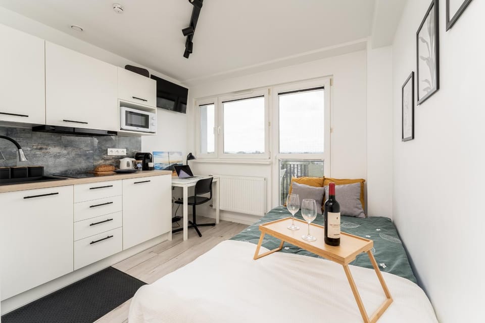 Bed, Kitchen or kitchenette, Seating area