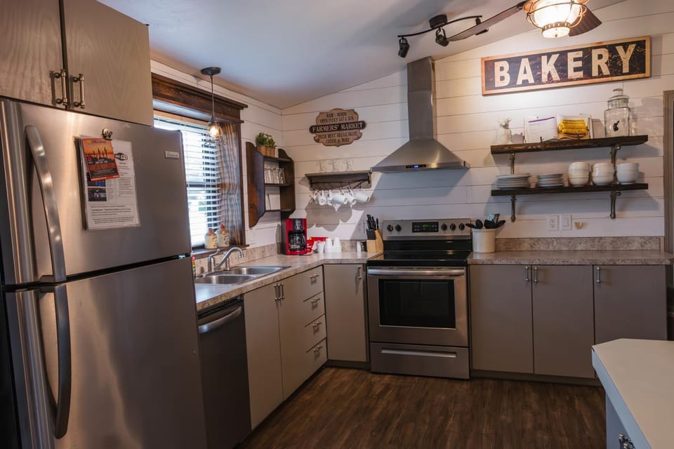 Kitchen or kitchenette, dishwasher, oven, stove