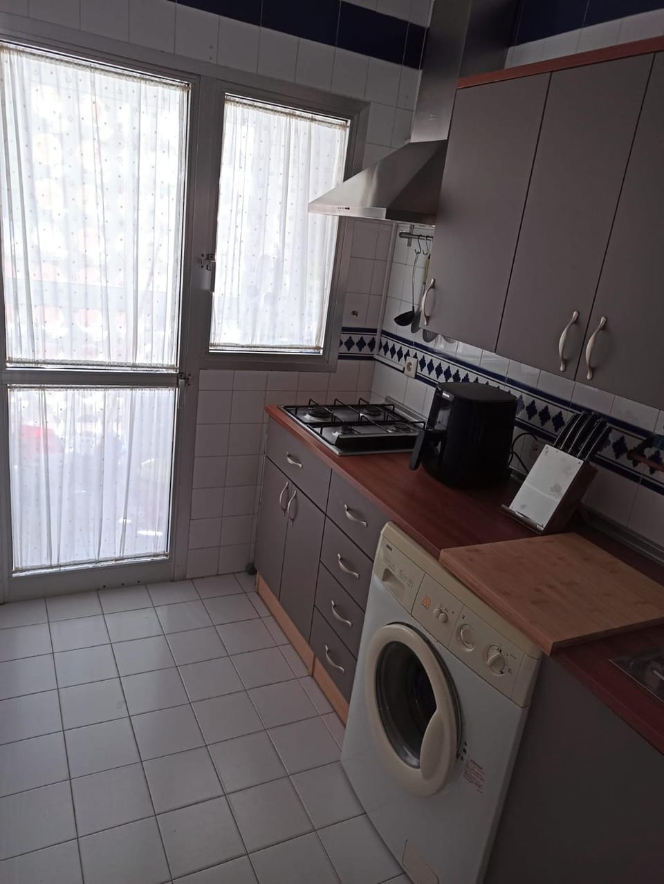 Kitchen or kitchenette, stove, washing machine